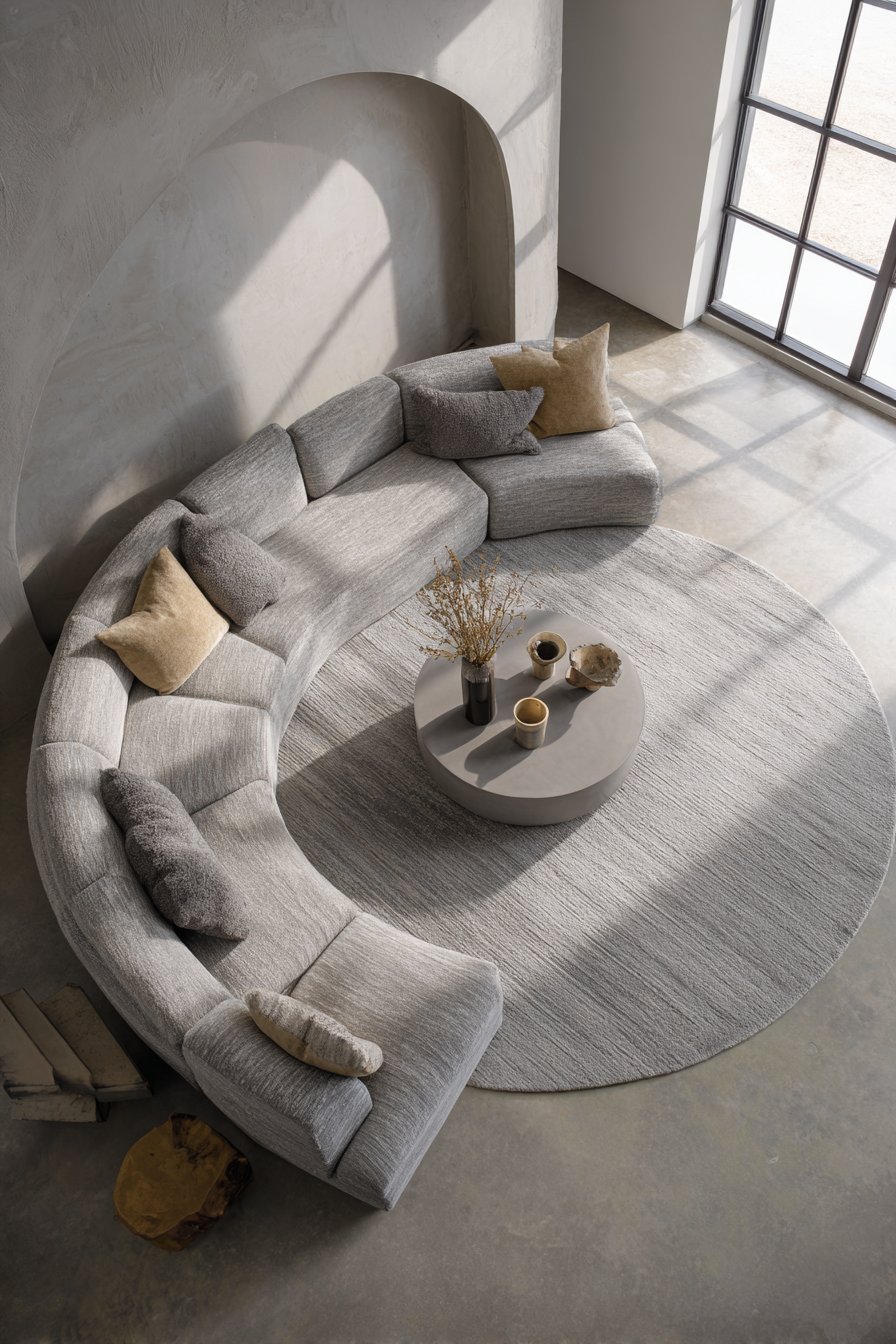 8-foot diameter circular rug in soft grey