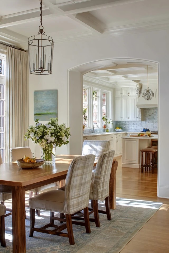 French doors or window wall between kitchen and dining