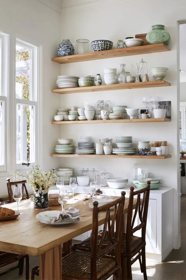 Round or square table positioned in corner with benches