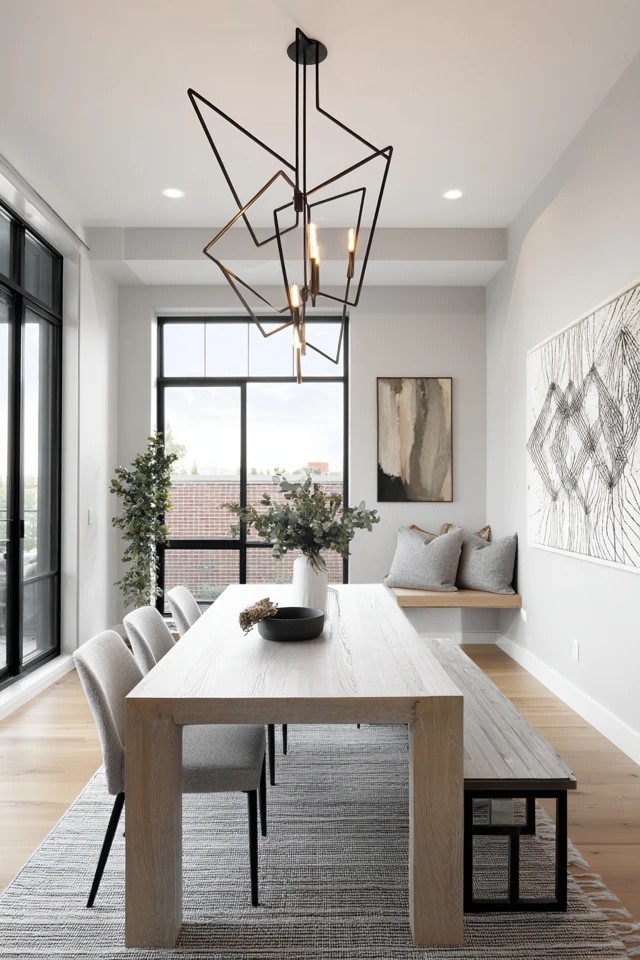 Large angular chandelier over simple rectangular table
