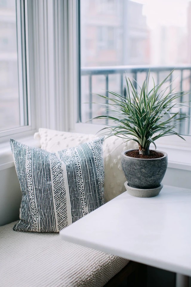 Monochromatic tonal color scheme creating serene visual cohesion in a small sunroom