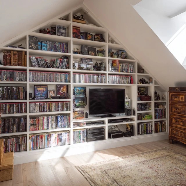 Mini refrigerator and snack counter creating a self-sufficient refreshment station in an attic TV room