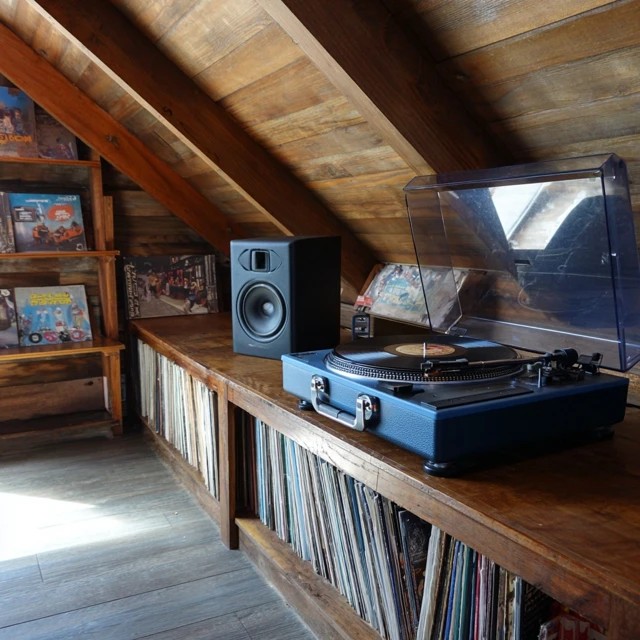 Wall-mounted mini basketball hoop providing active shooting practice and play in an attic game room