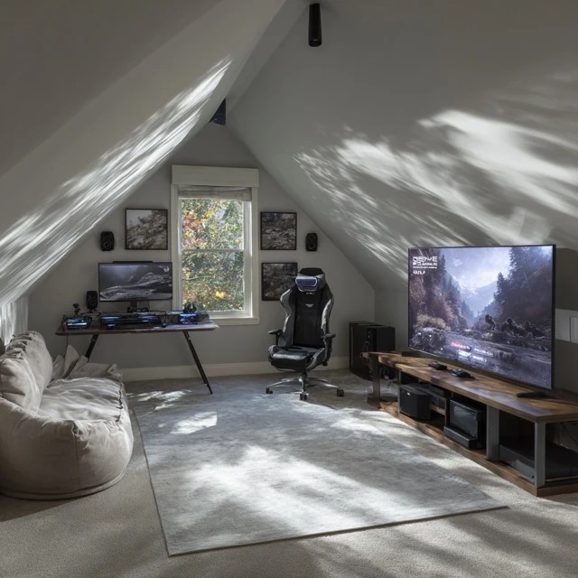 VR headset, sensors, and clear play boundary creating an immersive virtual reality gaming station in an attic game room