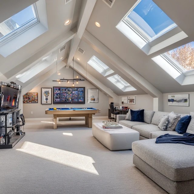 Roof window skylight flooding the attic game room with natural overhead daylight creating cheerful playing conditions